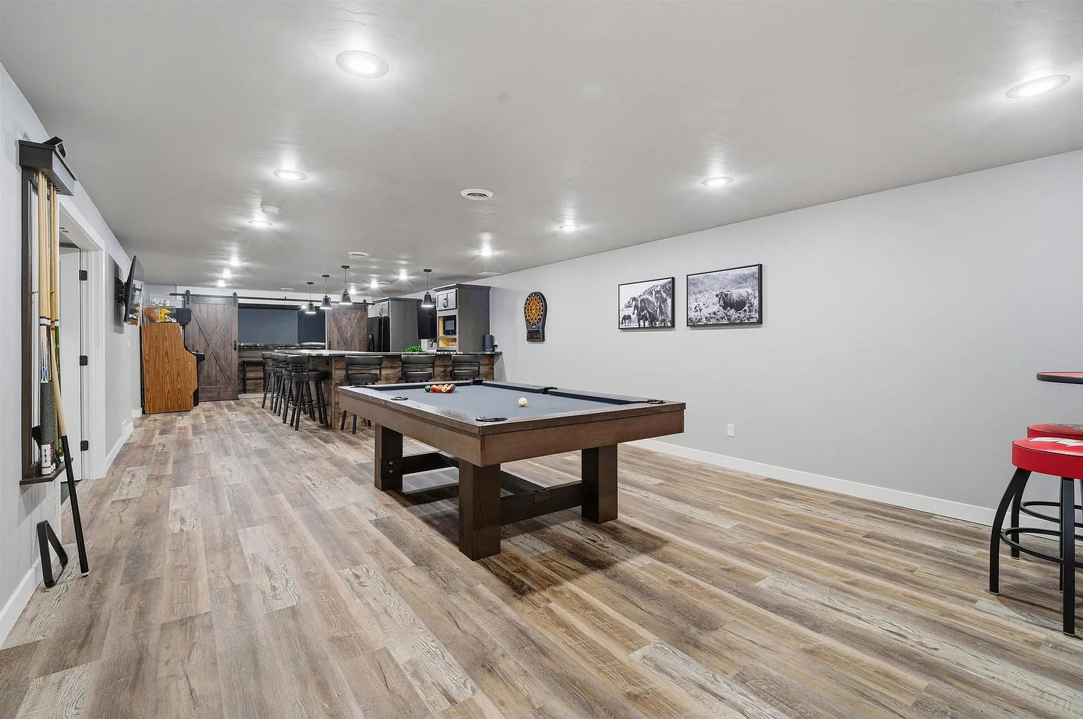 Rec lounge with pool table and bar beyond