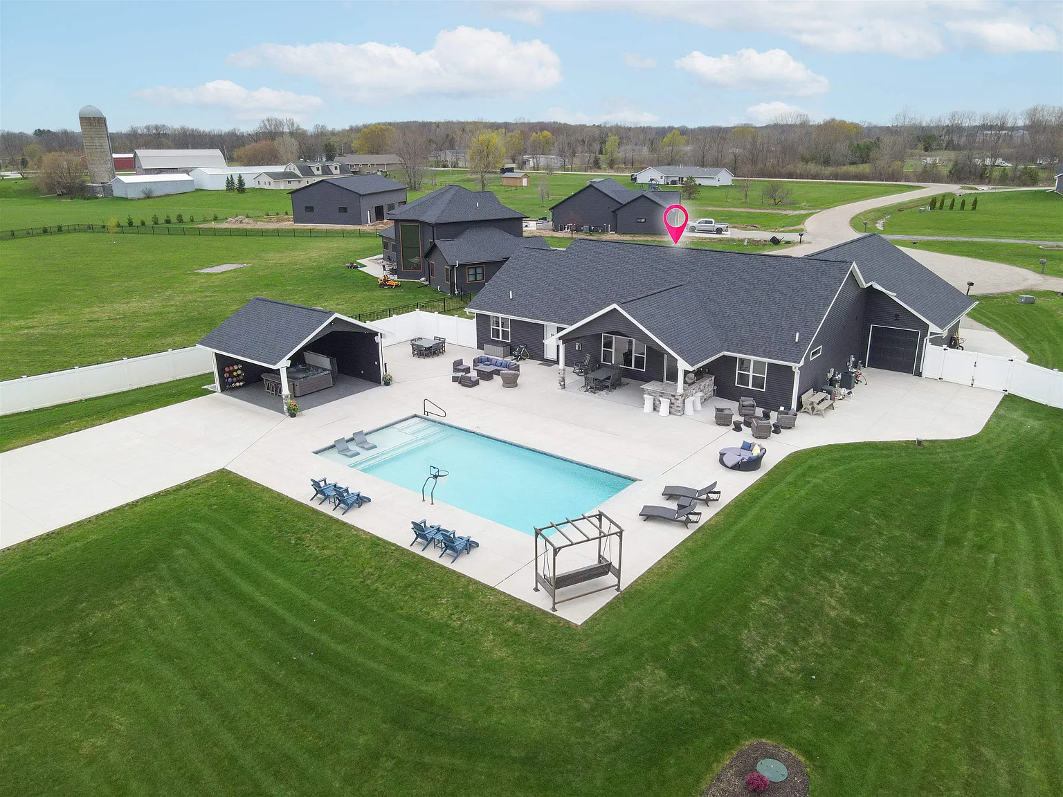 Aerial view of 594 Prairie Gardens Lane with resort-style backyard