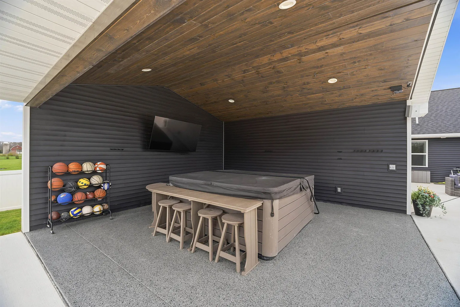 Covered pavilion with hot tub and bar seating